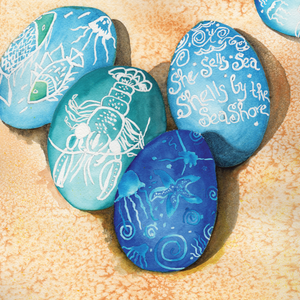 Easter eggs dyed turquoise blue and dark blue  with lobster, fishes, jelly fish and "She sells Sea Shells by the Seashore" on a beach.