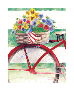Red Summer Bike with a basket of pansies on the back with an American Flag to help celebrate the 4th of July