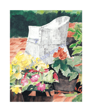 Load image into Gallery viewer, White wicker chair with a petunia garden