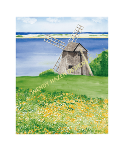 A Cape Cod Windmill by the ocean with a lagoon in front and a sand dune then beyond the Atlantic Ocean