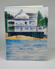Load image into Gallery viewer, The Albonegon Inn is now a private home sitting on the rocks looking towards the Boothbay Harbor entrance from the Atlantic Ocean.  It has the Ameican flag and just the beginning of one of the guest cottages.