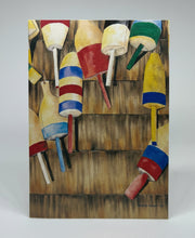 Load image into Gallery viewer, A weathered building with assorted lobster buoys hung on the wall