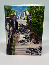 Load image into Gallery viewer, A walkway with foliage looking toward Cape Cod Bay.