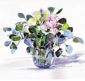 A vase filled with white and red variegated roses with Eucalyptus leaves throughout.