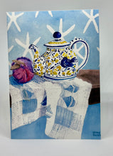 Load image into Gallery viewer, A yellow, white and blue teapot with a blue bird motif.  There is a red onion for color and interest as well as star fish images against a blue wall.