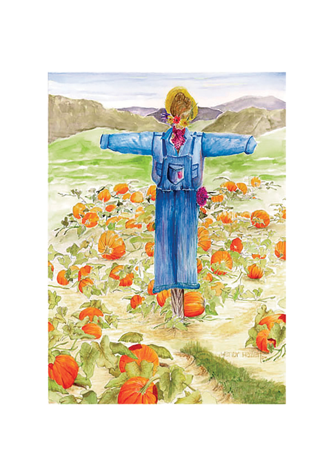 A field of pumpkins nestled in the valley with a scarecrow keeping watch.