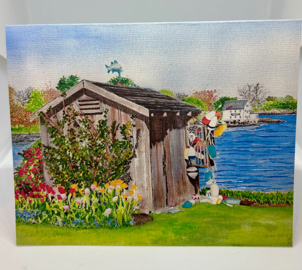 This is a watercolor of a New Castle, NH Garden Shed with red and yellow tulips and the Piscataqua Cafe in the distance across the cove.  it is early spring.  And there is a fish cupola on top of the wee shed