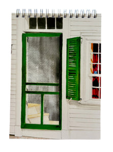 A green screen door with a green shutter and a red curtain in the window.  