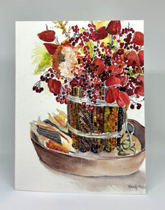 Multicolored Indian Corn ted in two spots with twin to hold it all around a glass vase on the inside.  Then dried flowers are placed inside with some corn laying on the table within a wooden round tray.