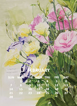 Load image into Gallery viewer, A watercolor-style floral calendar page for February, showing pink, yellow, and purple flowers with green leaves on a soft cream background, with the days of the week and month name printed in white near the bottom.