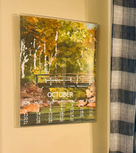 Load image into Gallery viewer, A poster calendar image framed within the Acrylic Frame