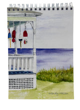 Load image into Gallery viewer, A front porch looking out towards the sea with stranded Lobster Buoys hanging along the porch roof beam.