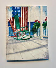 Load image into Gallery viewer, Painting of a green and red rocking chairs on a porch with an American flag and flowers looking out to sea.