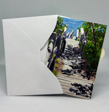 Load image into Gallery viewer, the Memory Lane card being inserted into an envelope