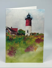 Load image into Gallery viewer, Nauset Lighthouse is absolutely spectacular with the colors of fall in the forefront and the lighthouse and the house just poised under an overcast sky.