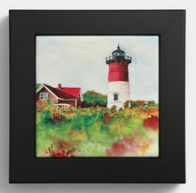 Load image into Gallery viewer, The image is of Nauset Lighthouse in the fall with colorful forefront bushes and a light blue sky