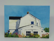 Load image into Gallery viewer, A hand-cut greeting card featuring a watercolor illustration of a house with a blue sky and flowers in the foreground.