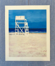 Load image into Gallery viewer, Lifeguard tower on a beach with a blue sky, framed by a blue striped border.