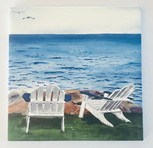 Load image into Gallery viewer, Two Adirondack chairs sitting on the lawn facing the water with a large rock in place.  And the ocean is mildly choppy with two seagulls in the upper left corner in a light blue sky