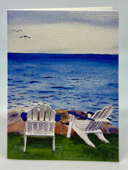 Two Adirondack Chairs by the sea looking towards the horizon.  Great spot to chat.