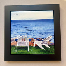 Load image into Gallery viewer, Two Adirondack chairs sitting on the lawn facing the water with a large rock in place. 