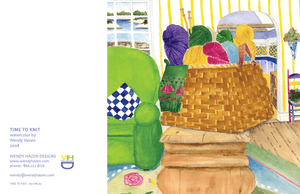 Knitting basket with colorful yarn skeins and wooden needles.  Family room setting with kitchen in background and waterview