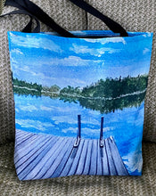Load image into Gallery viewer, A canvas bag with a wrap around painting from the dock on a quiet July morning.  Not a ripple to be seen.  There's a ladder there to help you out of the lake from the first morning swim.
