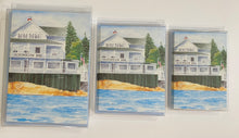 Load image into Gallery viewer, 3 different sizes of the Albonegon Inn perched on the rocks with the water flowing by.