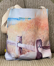 Load image into Gallery viewer, The Brewster Beach Path design wraps around the entire canvas bag which is 16"X 16"X 2.5" and has 2 black straps for easy carrying or over the shoulder