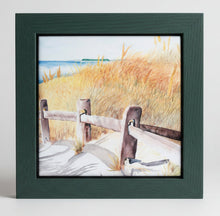 Load image into Gallery viewer, This is the end of Crosby Lane in Brewster on Cape Cod.  It is a ceramic tile with the weathered split rail fence guiding you out to the beach with beach grass all guiding you towards the water and the horizon of blue sky.  Also there is a black wooden frame surrounding the tile that aids in hanging the tile or protecting any surface it is placed on.