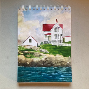 This is Nubble Light with a storm brewing in the Atlantic Ocean behind it.