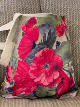 Load image into Gallery viewer, The Red Poppies design wraps around the entire canvas bag which is 16"X 16"X 2.5" and has 2 black straps for easy carrying or over the shoulder