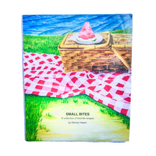 Load image into Gallery viewer, A cookbook cover featuring an illustration of a lobster pie on a table with a red and white checkered tablecloth, titled 'SMALL BITES' by Wendy Hazen.