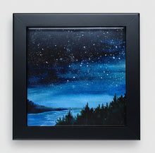 Load image into Gallery viewer, A ceramic tile of a starry night on the water with pine trees on the shore surrounded by a black wooden frame.
